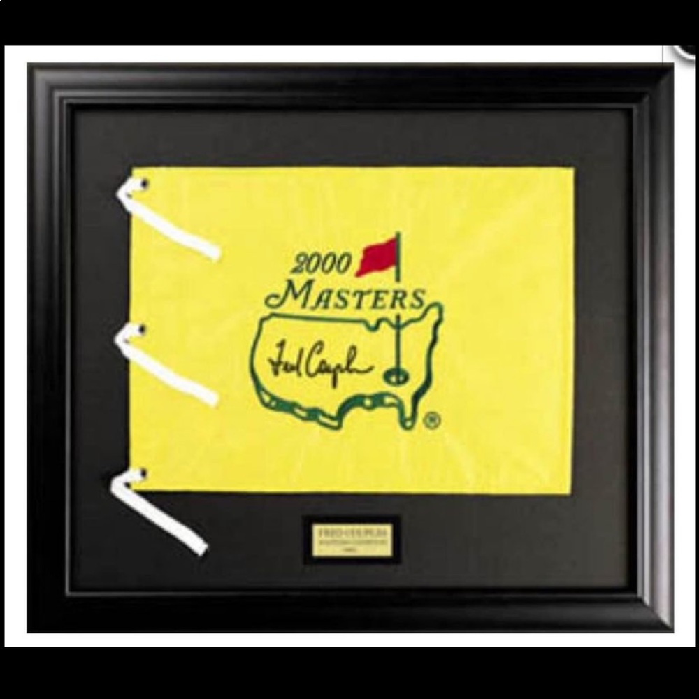 Masters flag autographed by champion Fred Couples. Authenticated.